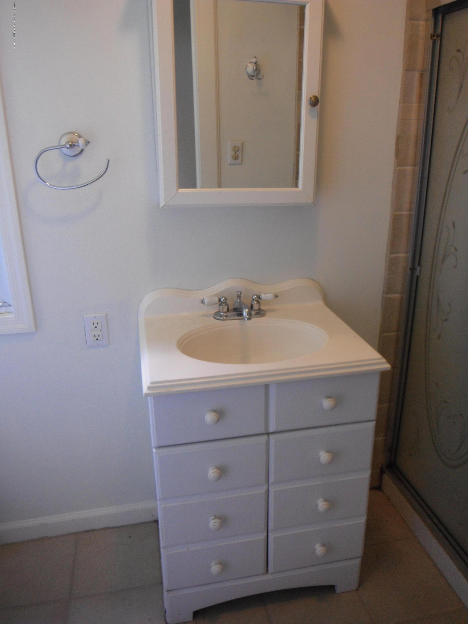 3 Colonial Drive Little Egg Harbor, NJ 08087 - Photo 19 of 21 a bathroom with a sink and cabinets
