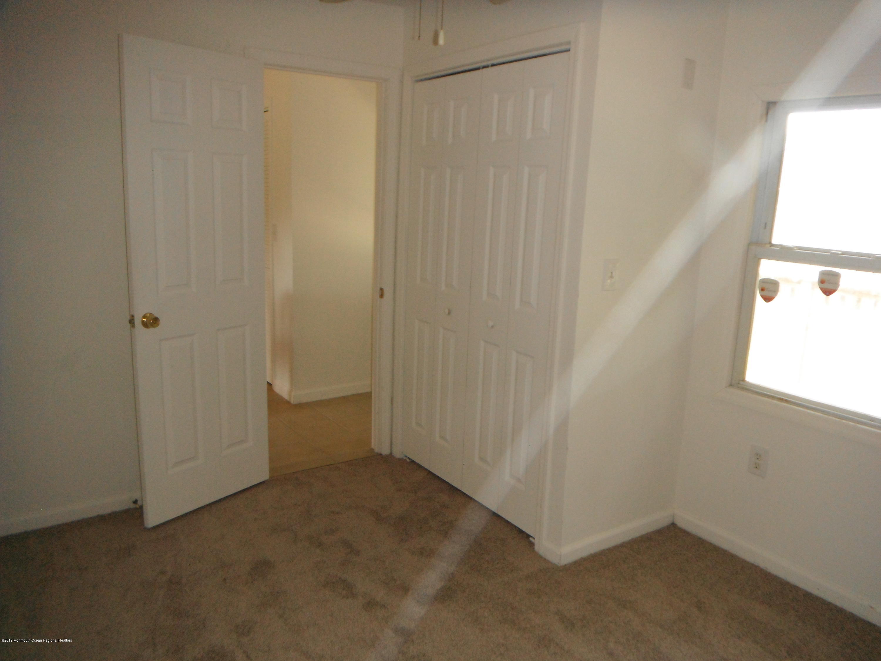3 Colonial Drive Little Egg Harbor, NJ 08087 - Photo 5 of 21 an empty room with a window