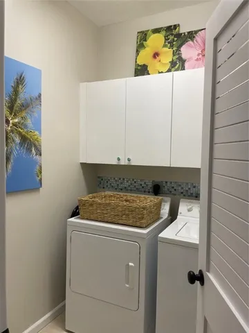a utility room with dryer and washer