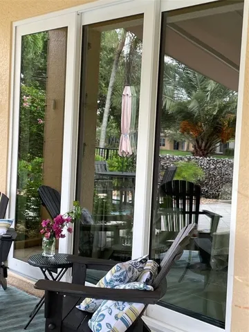 a room filled with furniture and garden view