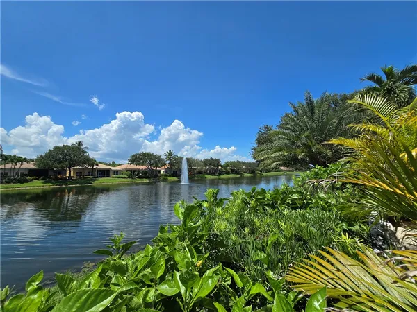 a view of a lake with a house in the background