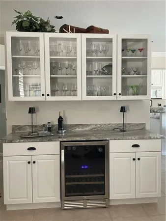 a kitchen with granite countertop a stove a sink and a granite counter tops