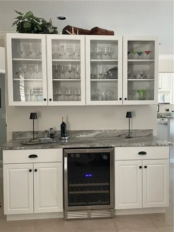 a kitchen with granite countertop a stove a sink and a granite counter tops
