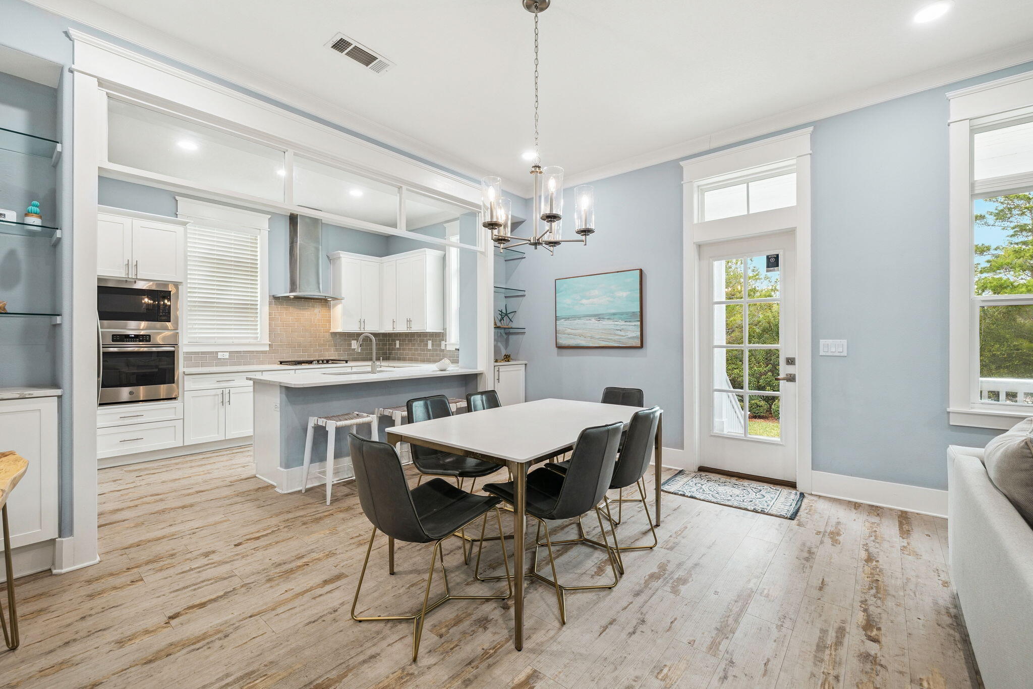 135 Gulfview Circle Santa Rosa Beach, FL 32459 - Photo 19 of 49 a view of a dining room with furniture window and wooden floor