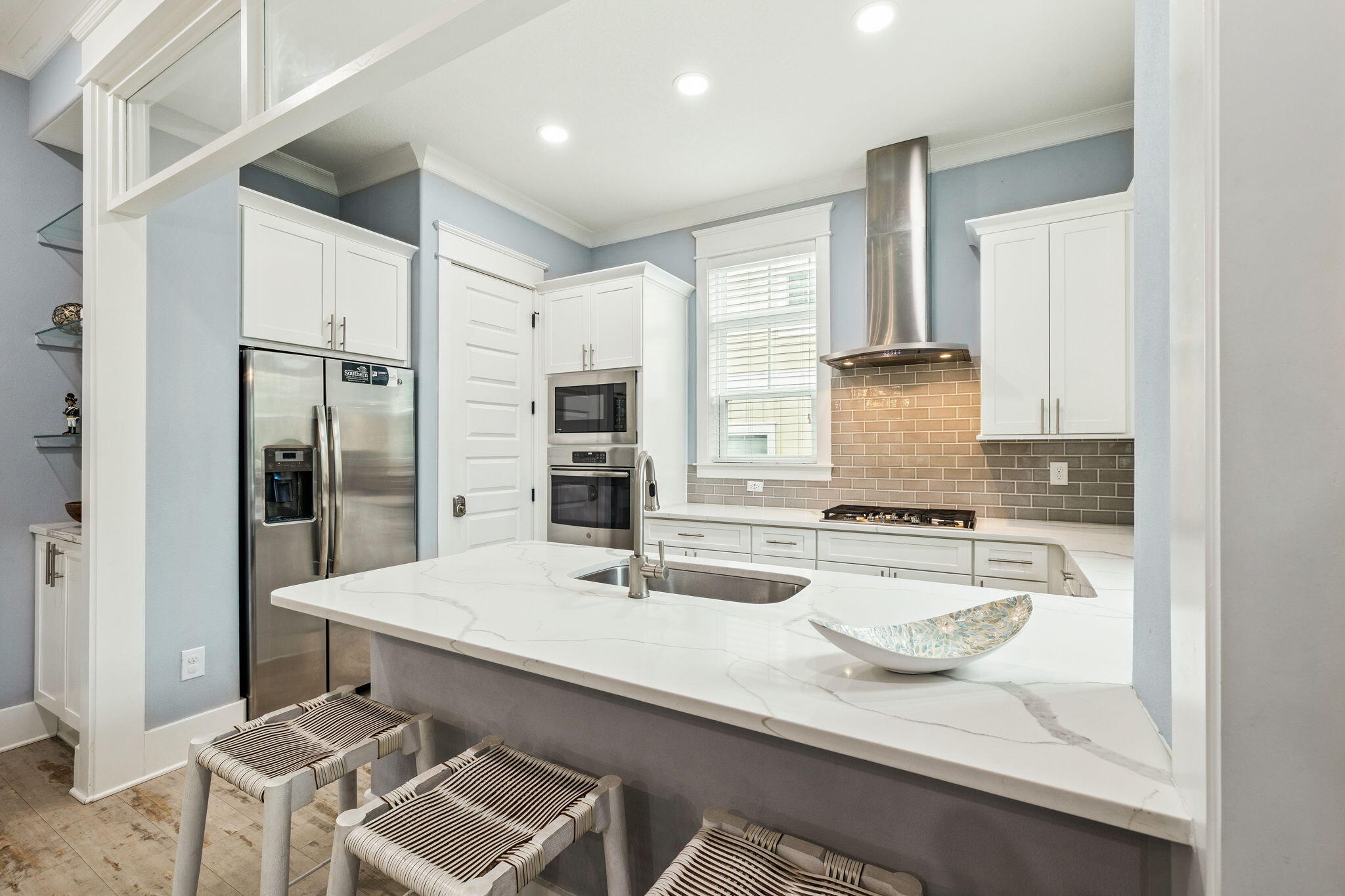 135 Gulfview Circle Santa Rosa Beach, FL 32459 - Photo 22 of 49 a kitchen with stainless steel appliances a sink and a refrigerator