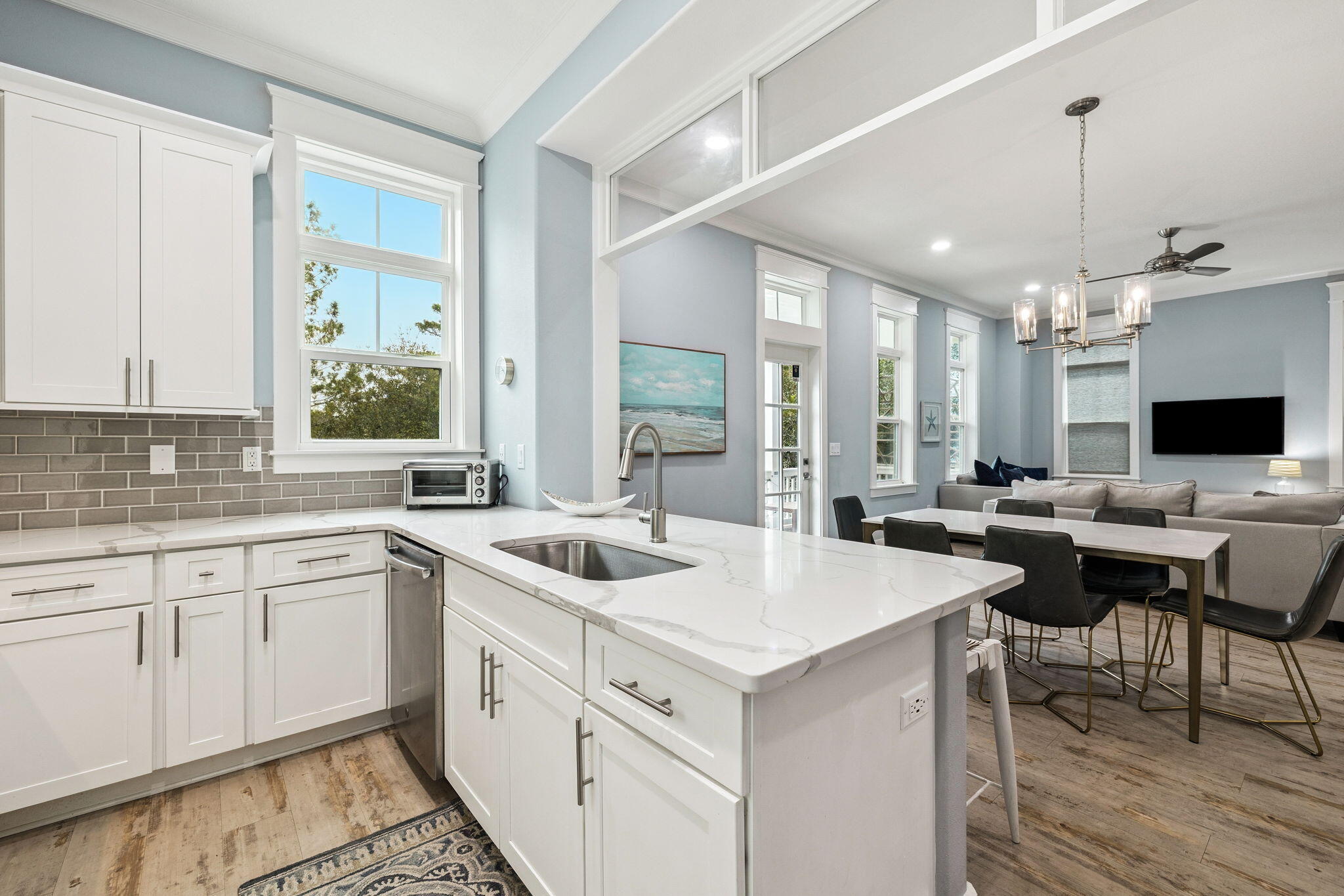 135 Gulfview Circle Santa Rosa Beach, FL 32459 - Photo 26 of 49 a view of a kitchen area with furniture and wooden floor