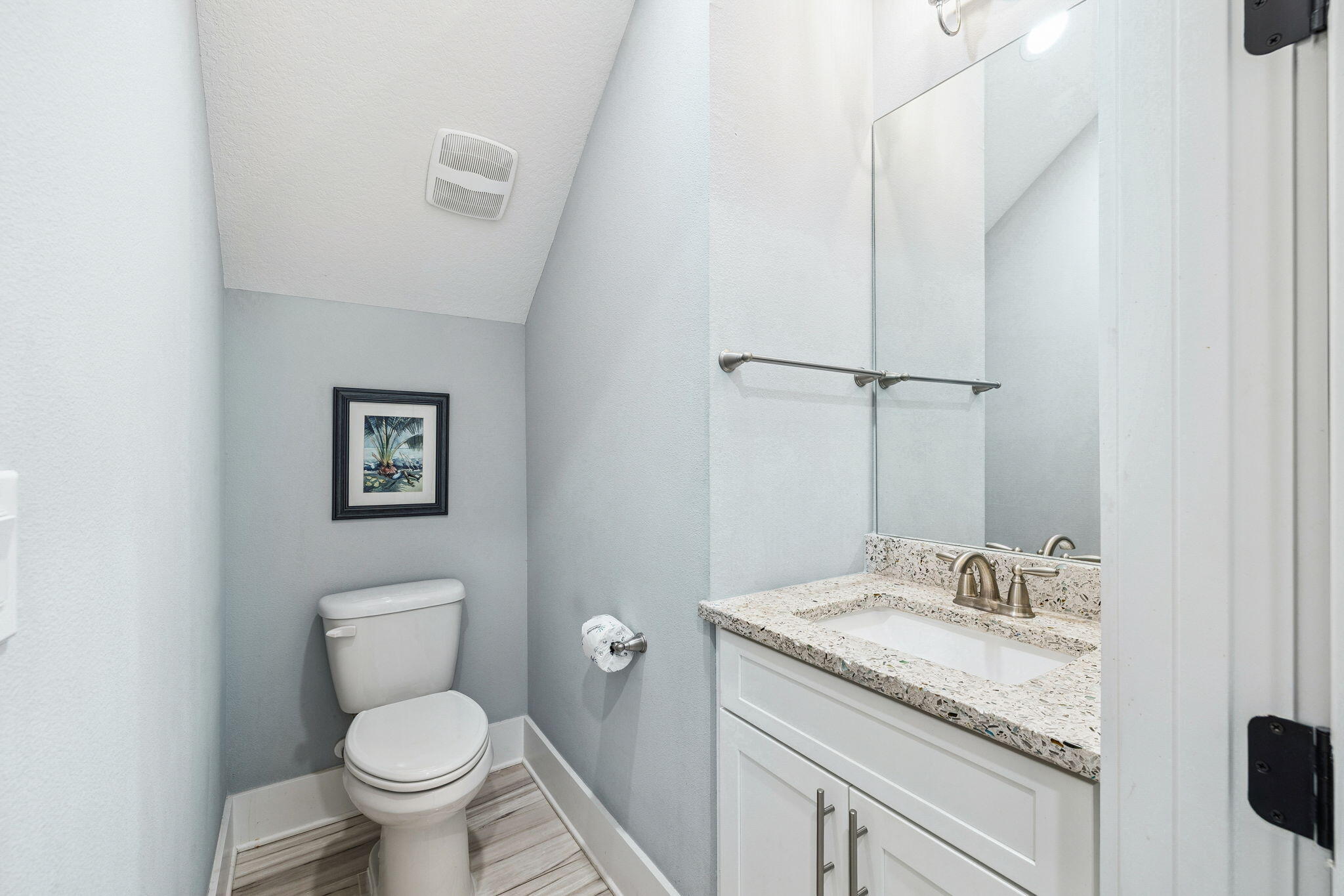 135 Gulfview Circle Santa Rosa Beach, FL 32459 - Photo 34 of 49 a bathroom with a granite countertop toilet sink and a mirror