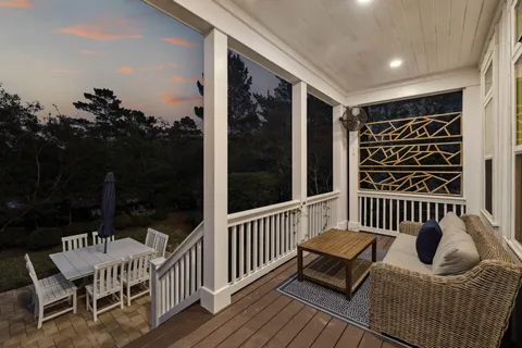 a patio with a yard table and chairs