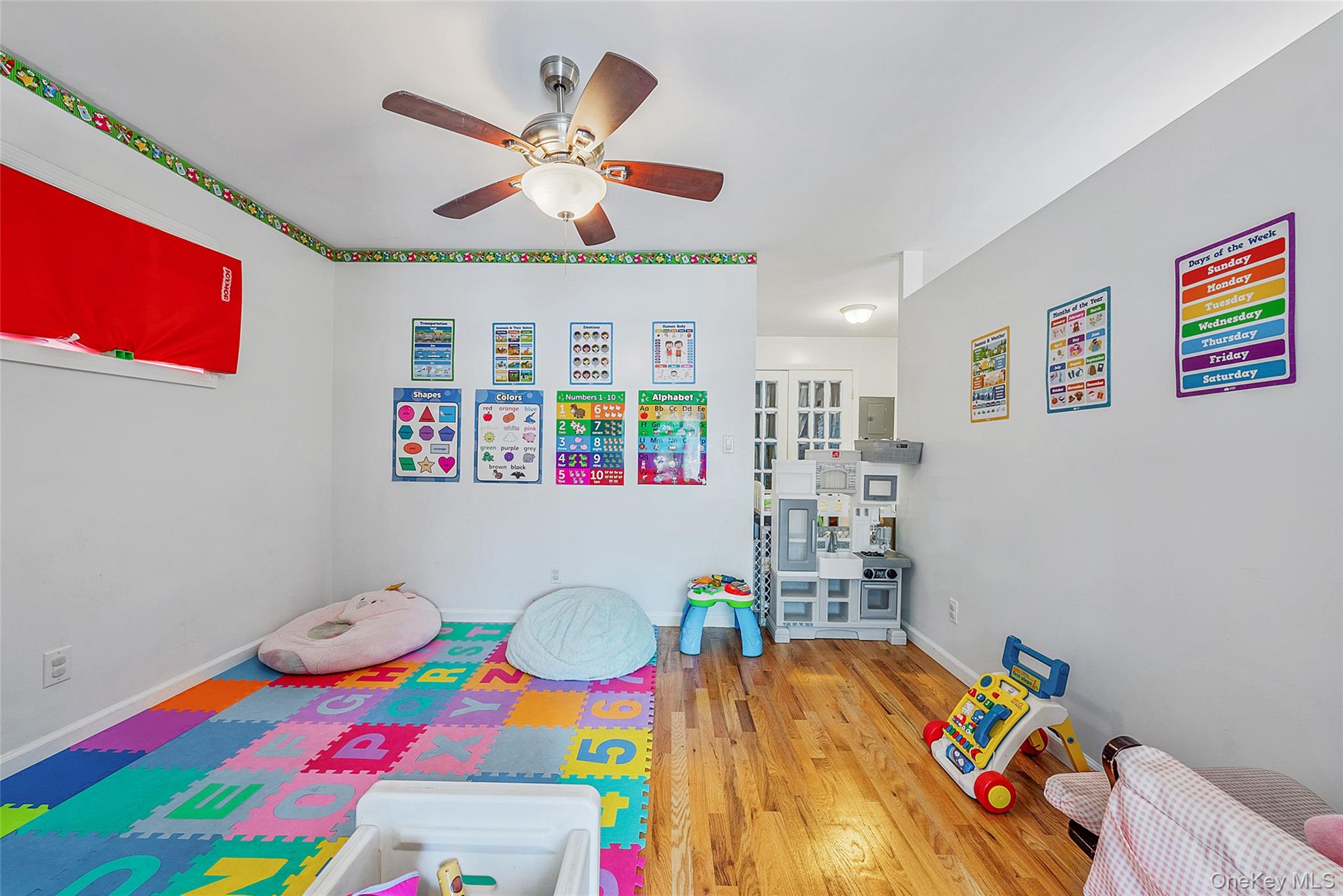 80 George Street Babylon, NY 11702 - Photo 25 of 41 a bedroom with a bed and a bookshelf