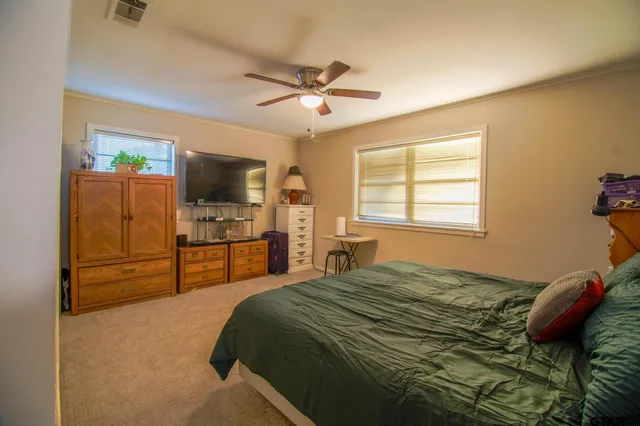 a front view of a house with garden and porch