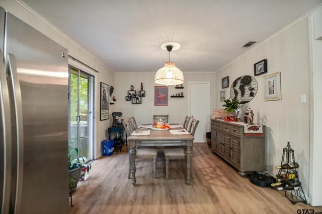 a bathroom with a sink and mirror with bathtub