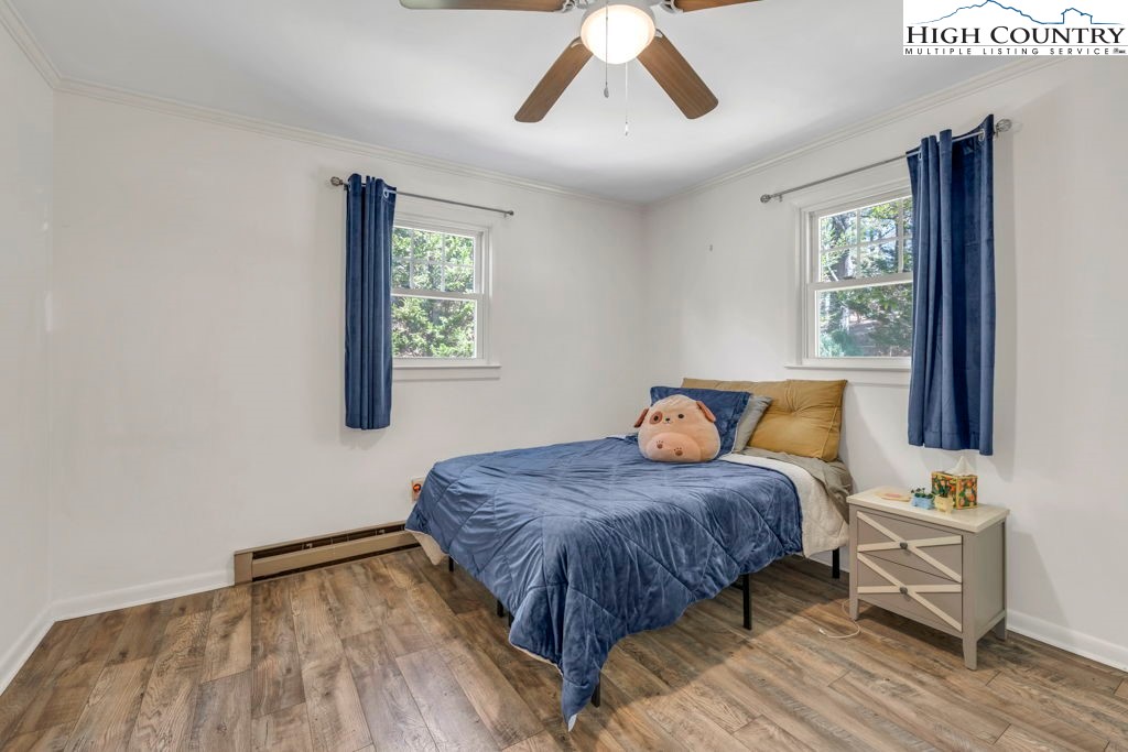 156 Olancha Avenue Boone, NC 28607 - Photo 13 of 23 a bedroom with a bed and wooden floor