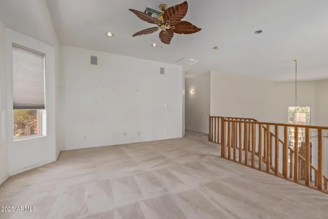 a bedroom with a bed a lamp and a dresser