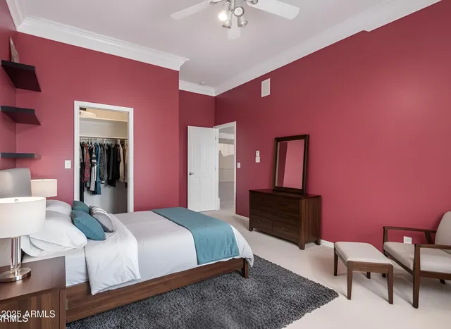 a view of a livingroom with a red ceiling fan