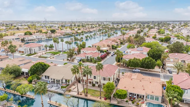 an aerial view of residential houses with outdoor space