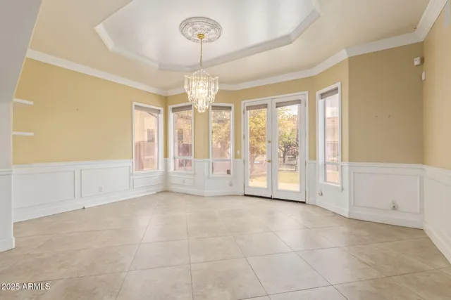 a kitchen with stainless steel appliances granite countertop a kitchen island a stove a table and chairs