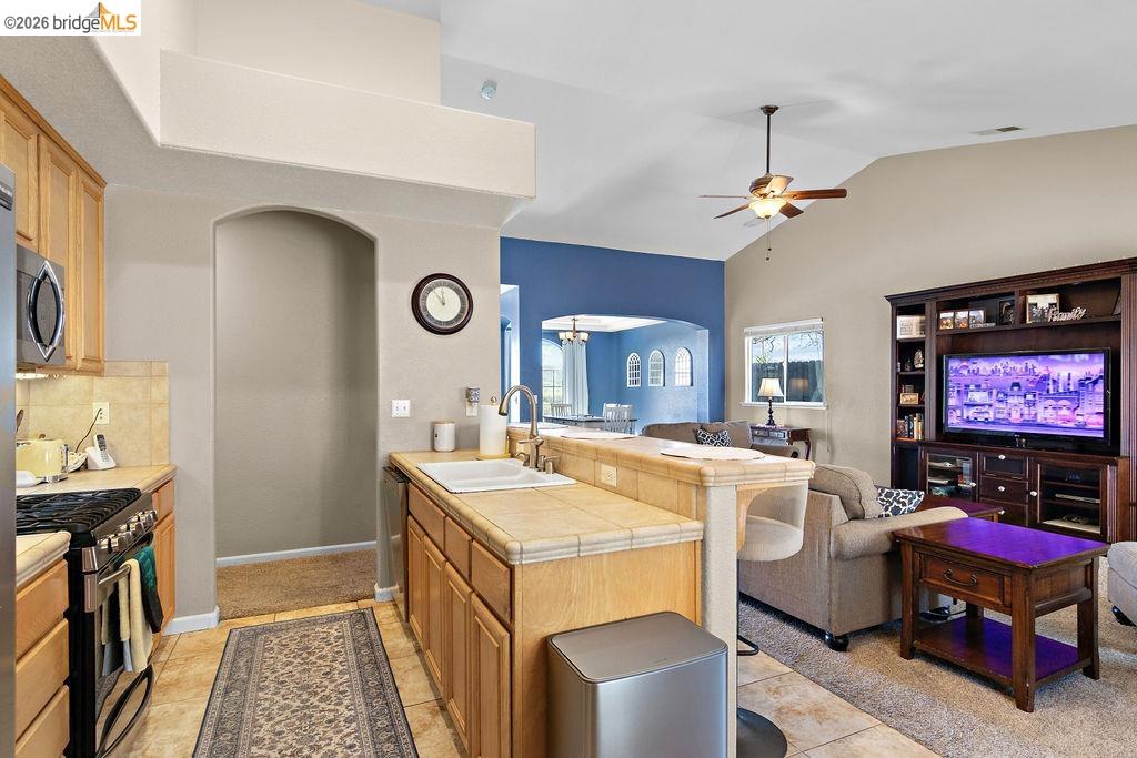 4955 Little John Road Copperopolis, CA 95228 - Photo 60 of 60 a kitchen that has a lot of cabinets a sink and a stove in it