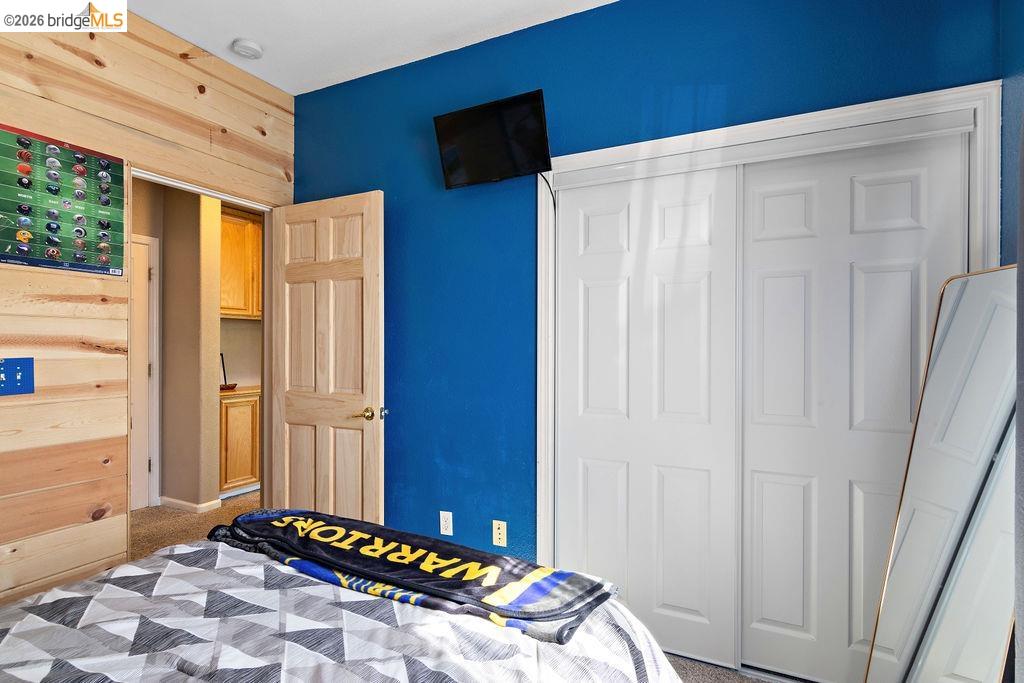 4955 Little John Road Copperopolis, CA 95228 - Photo 12 of 60 a bedroom with a bed and a window