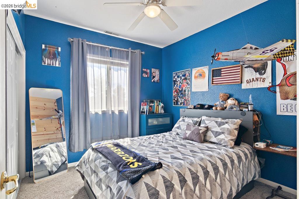 4955 Little John Road Copperopolis, CA 95228 - Photo 13 of 60 a bedroom with bed and a window