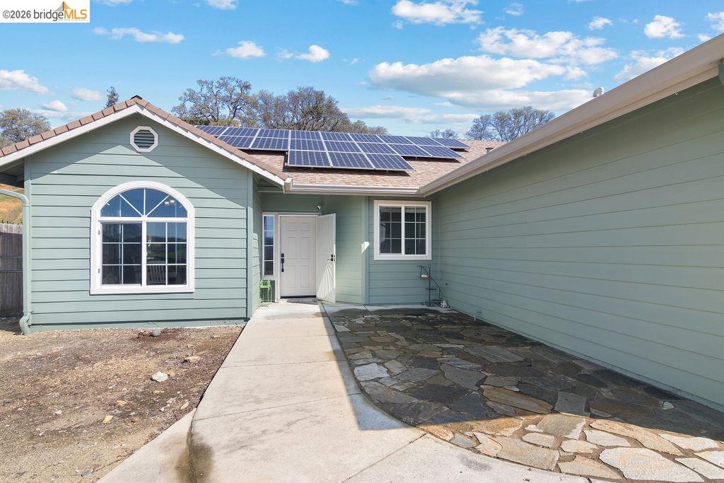 4955 Little John Road Copperopolis, CA 95228 - Photo 2 of 60 a front view of a house with a yard