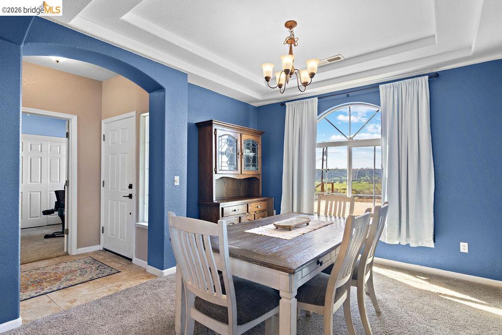 4955 Little John Road Copperopolis, CA 95228 - Photo 20 of 60 a view of a dining room with furniture window and outside view