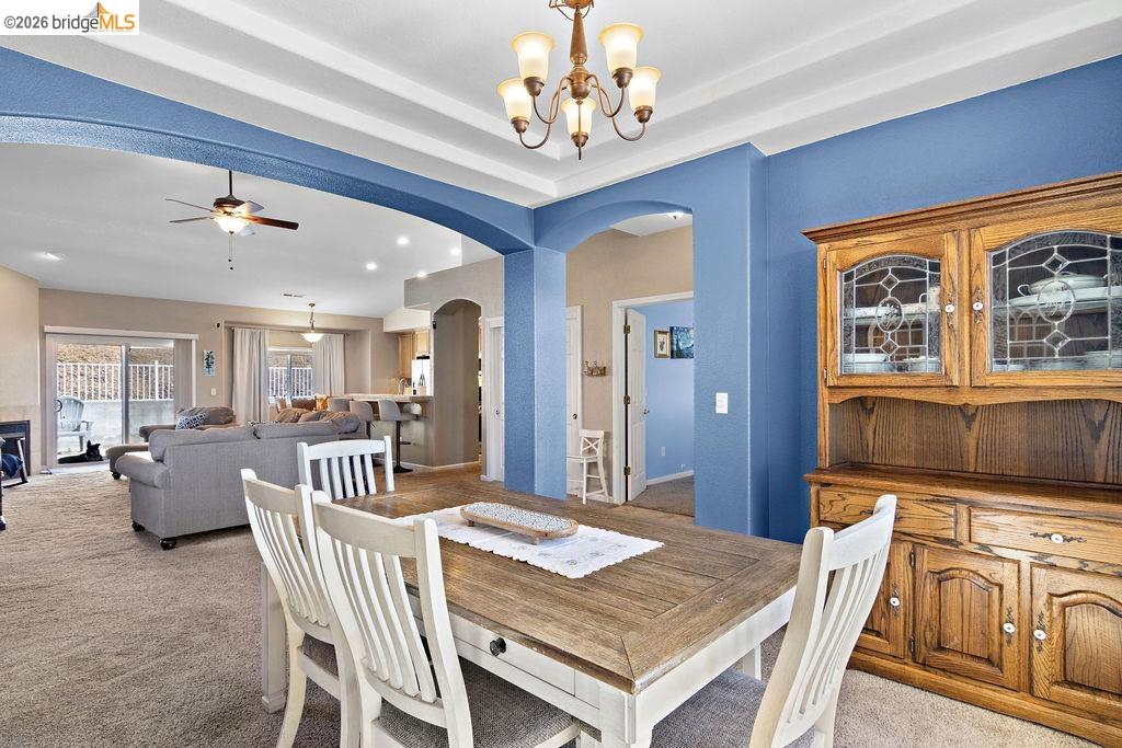 4955 Little John Road Copperopolis, CA 95228 - Photo 21 of 60 a view of a dining room with furniture window and wooden floor