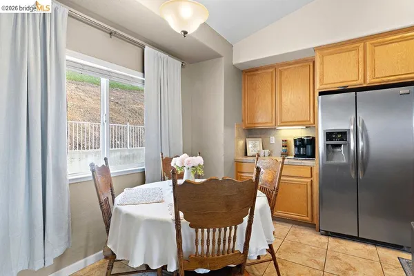 a view of a dining room with furniture window and outside view