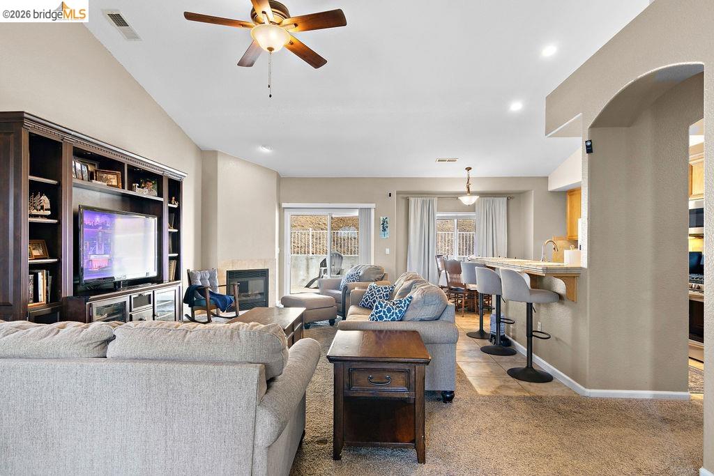 4955 Little John Road Copperopolis, CA 95228 - Photo 23 of 60 Living room featuring ceiling fan, recessed lighting, a fireplace, and light carpet