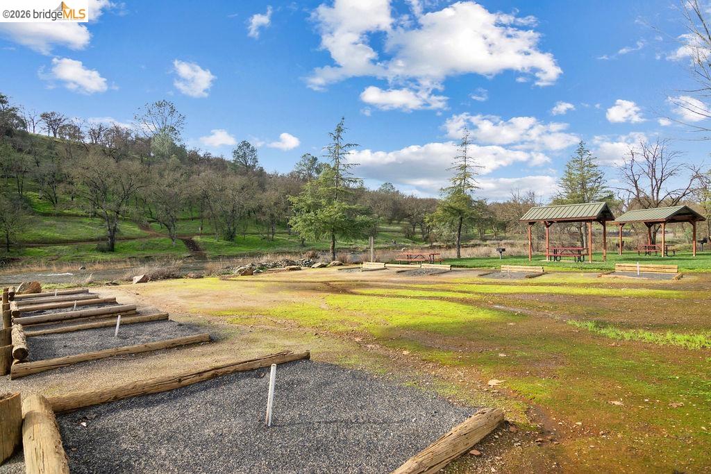 4955 Little John Road Copperopolis, CA 95228 - Photo 35 of 60 a view of a swimming pool with an outdoor seating