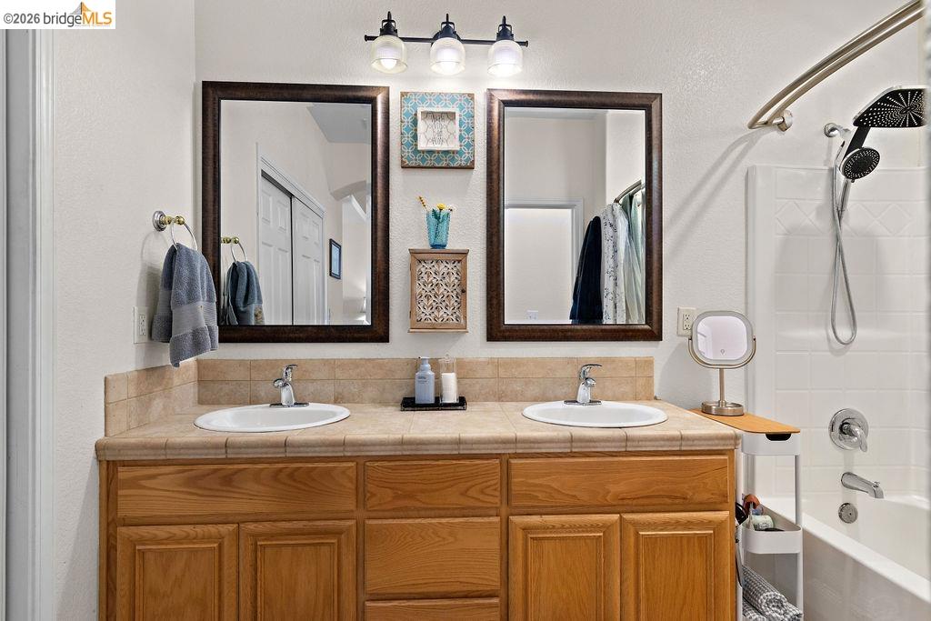4955 Little John Road Copperopolis, CA 95228 - Photo 39 of 60 a bathroom with a double vanity sink mirror and double