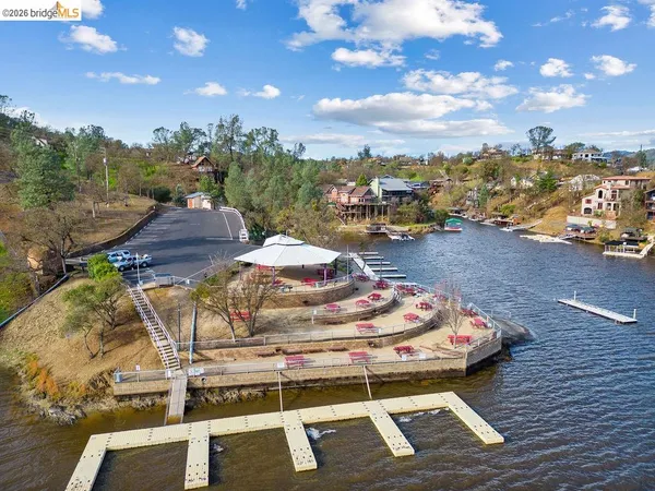 a view of a swimming pool and trees in the patio
