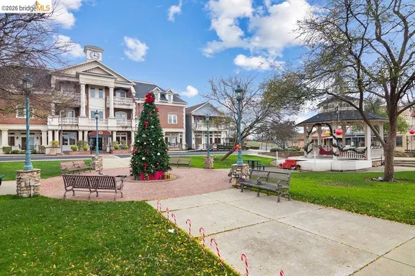 a view of a swimming pool with an outdoor seating