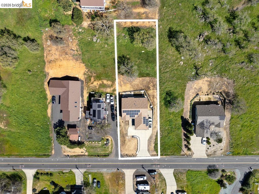 4955 Little John Road Copperopolis, CA 95228 - Photo 3 of 60 an aerial view of a residential houses with outdoor space