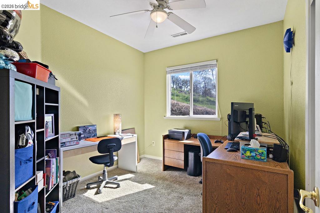 4955 Little John Road Copperopolis, CA 95228 - Photo 50 of 60 a view of a workspace with furniture and a window