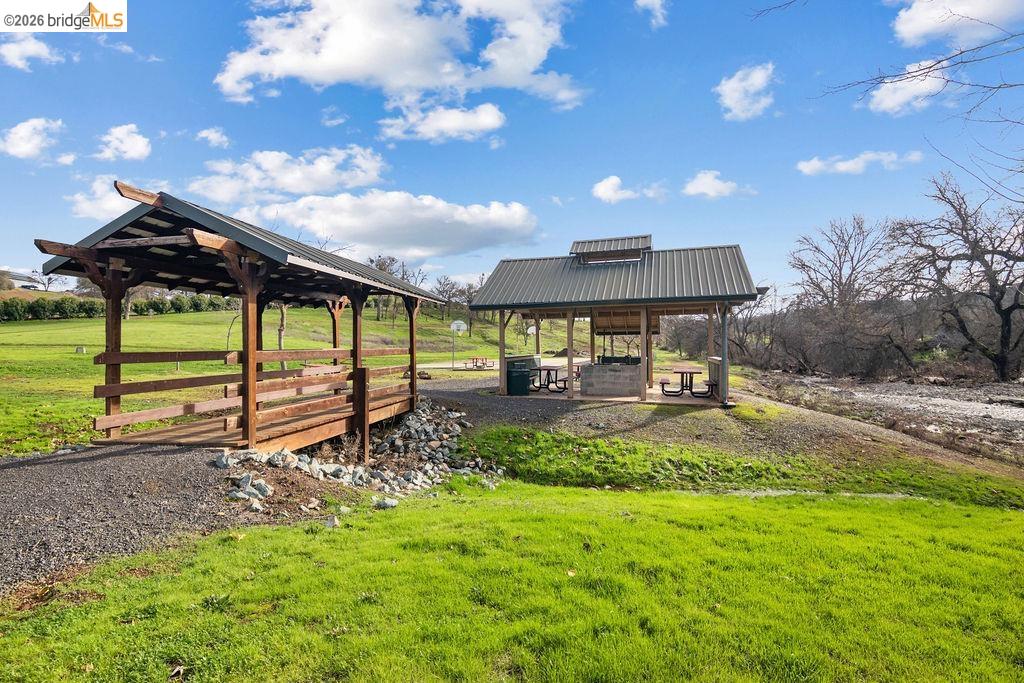 4955 Little John Road Copperopolis, CA 95228 - Photo 58 of 60 a view of a house with backyard and sitting area