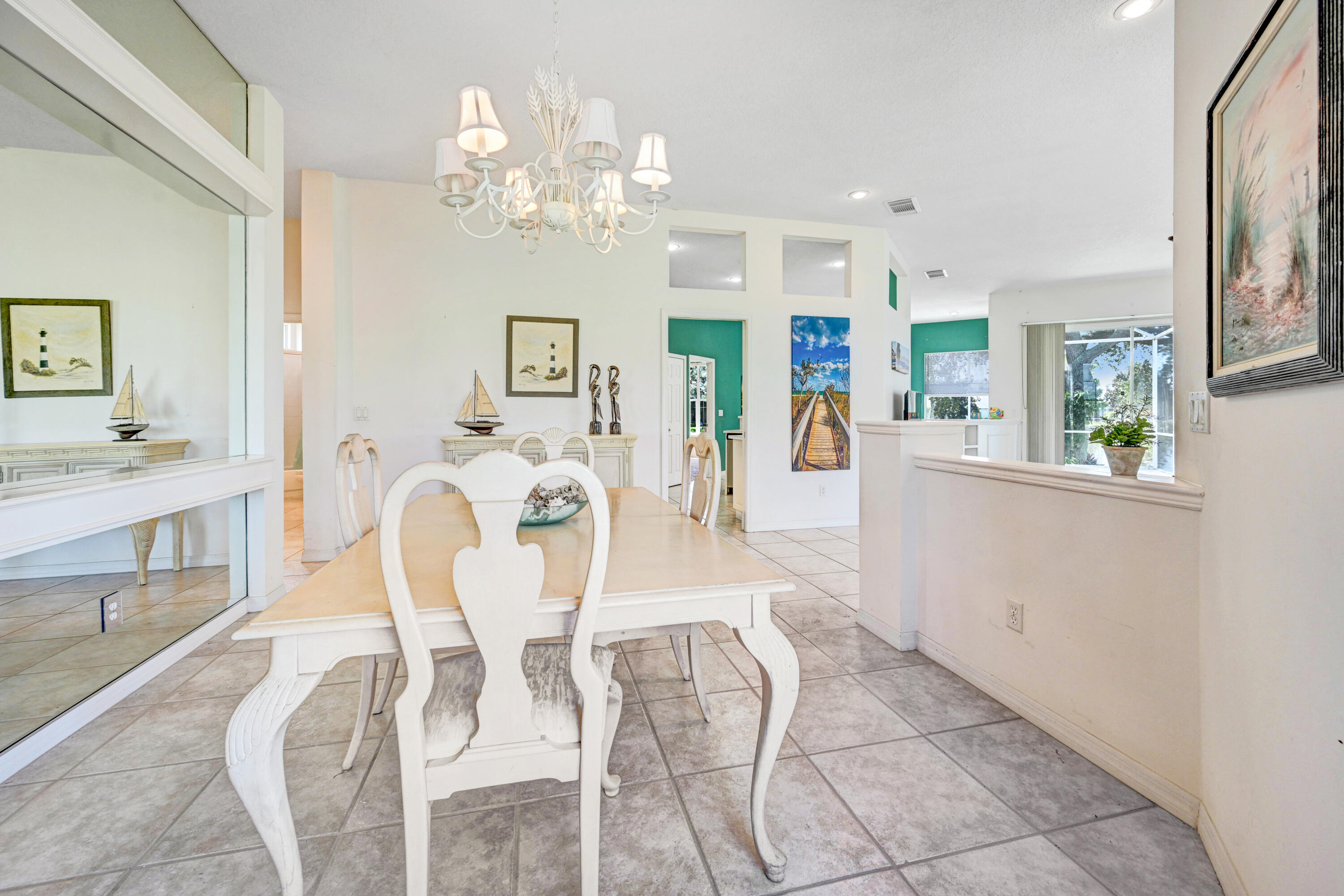 2299 Addington Circle Rockledge, FL 32955 - Photo 16 of 61 a view of a dining room with furniture and chandelier