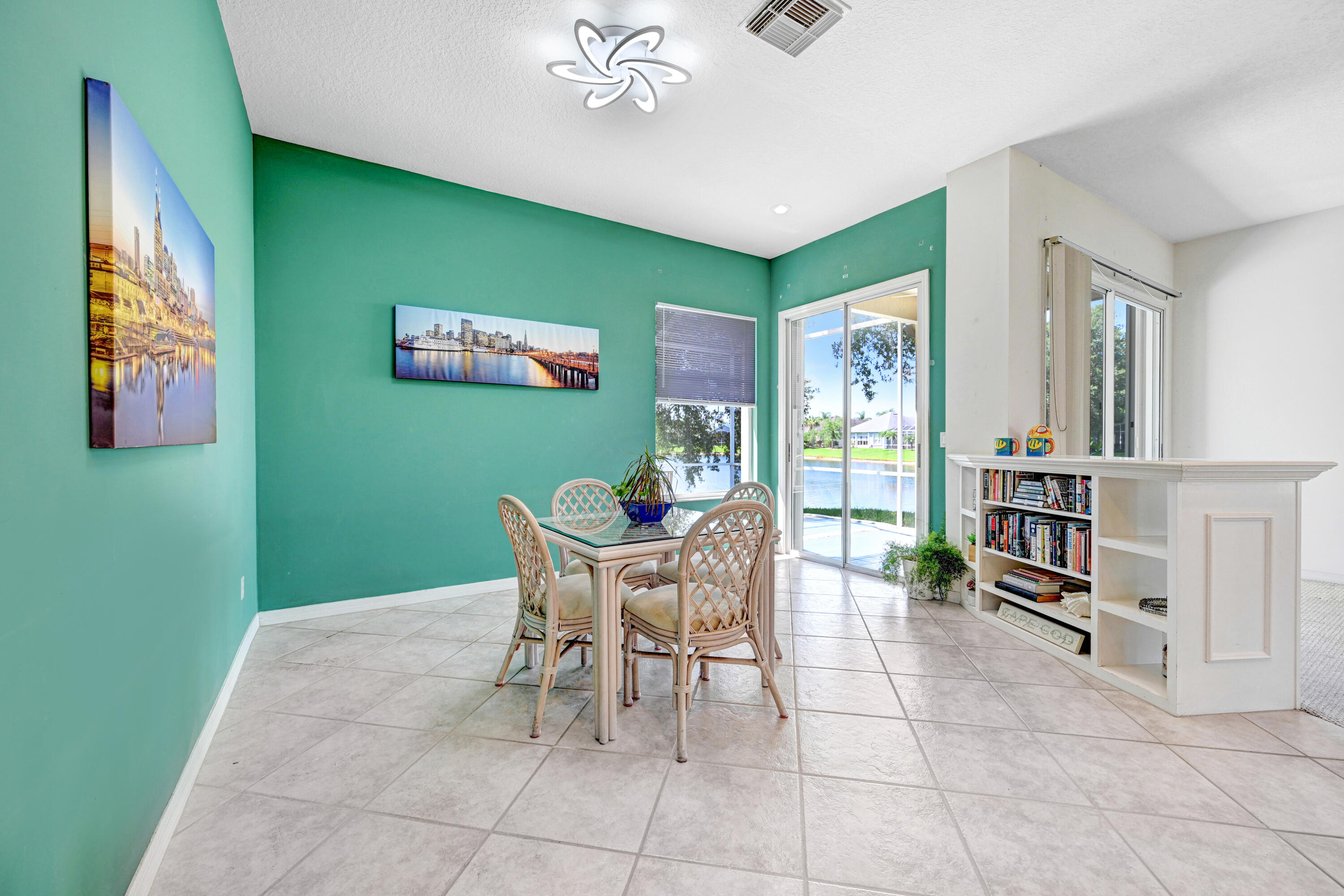 2299 Addington Circle Rockledge, FL 32955 - Photo 21 of 61 a dining room with furniture and a window