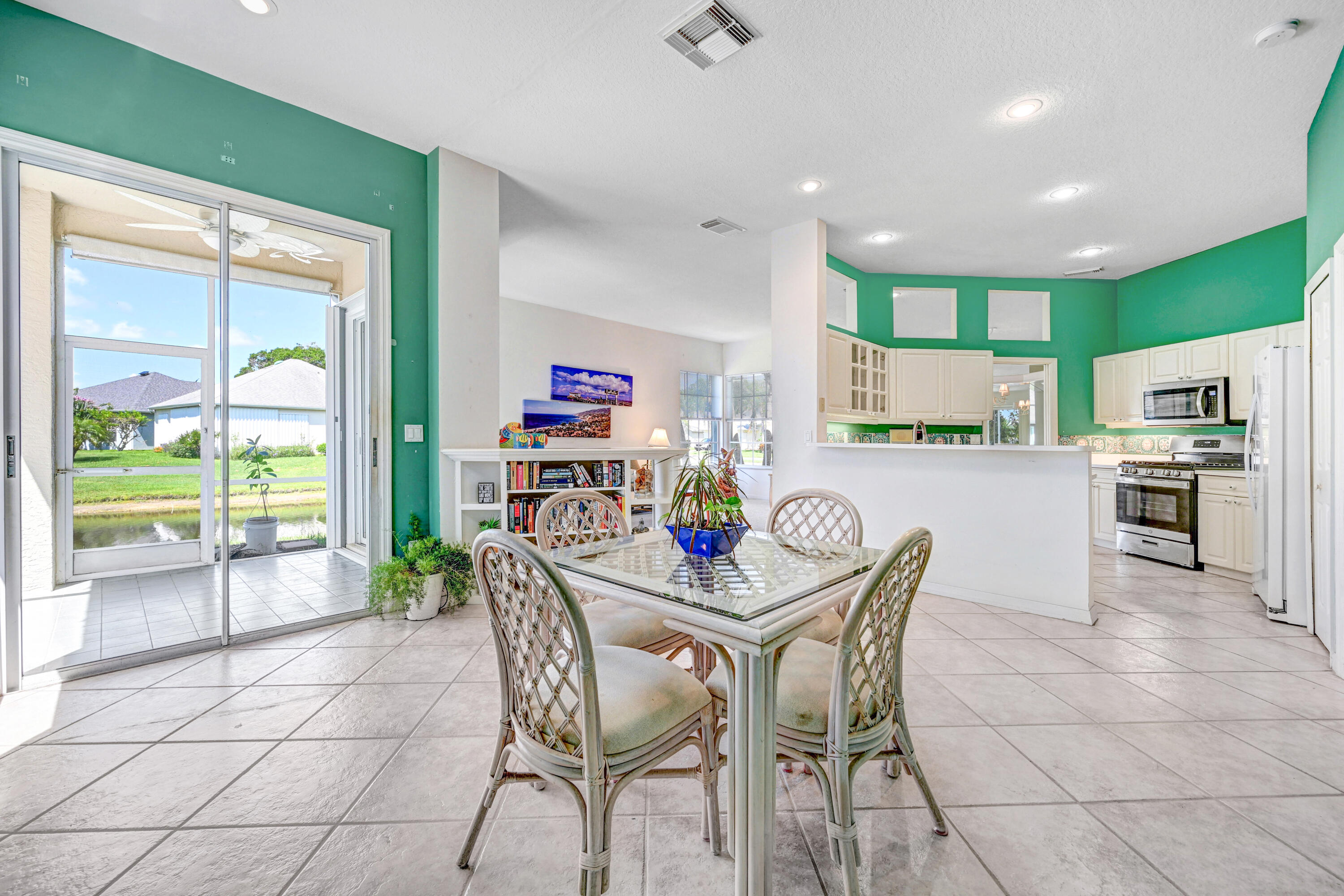 2299 Addington Circle Rockledge, FL 32955 - Photo 22 of 61 a kitchen with stainless steel appliances granite countertop a stove top oven a sink a counter space and cabinets