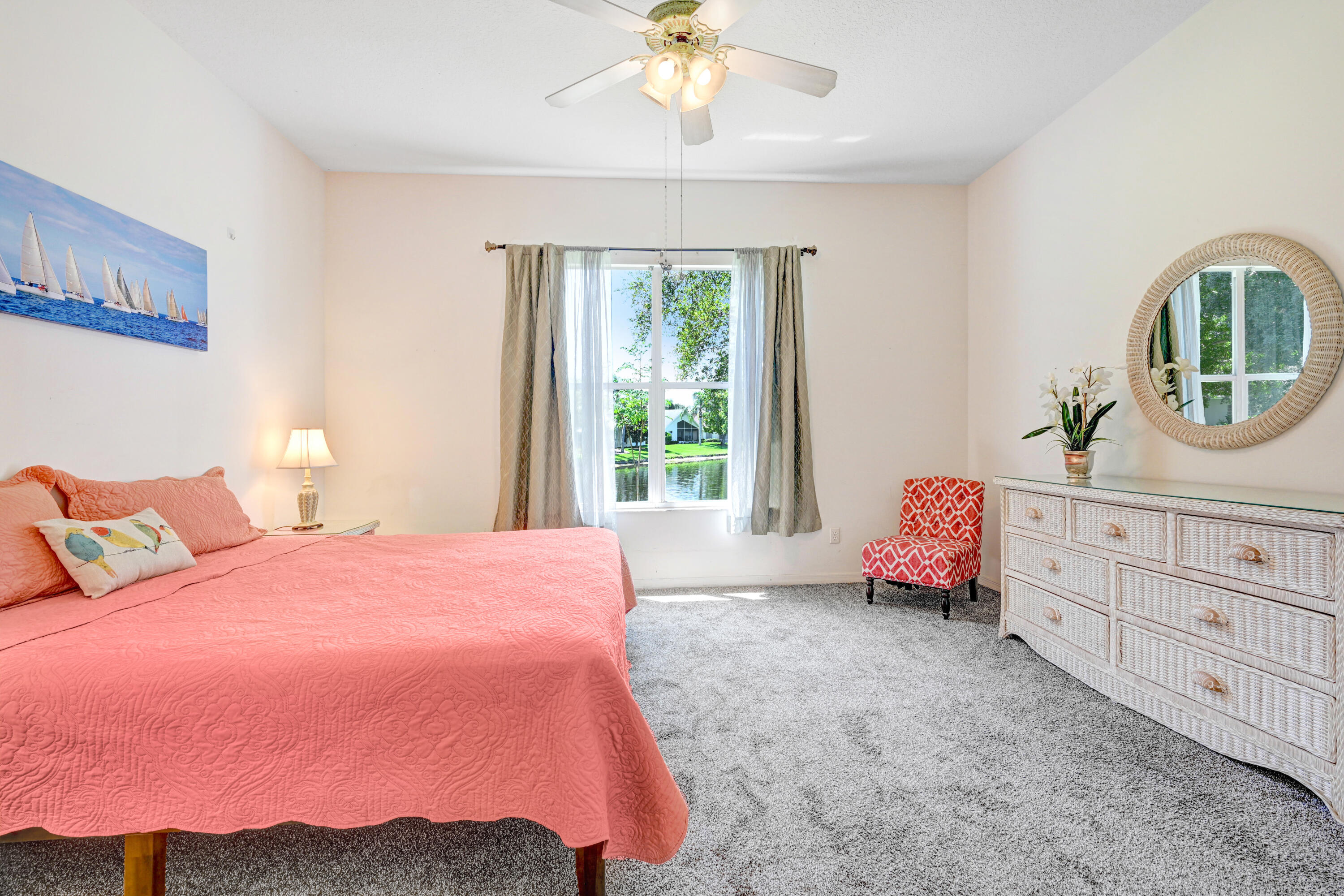 2299 Addington Circle Rockledge, FL 32955 - Photo 27 of 61 a spacious bedroom with a bed a dresser and a window