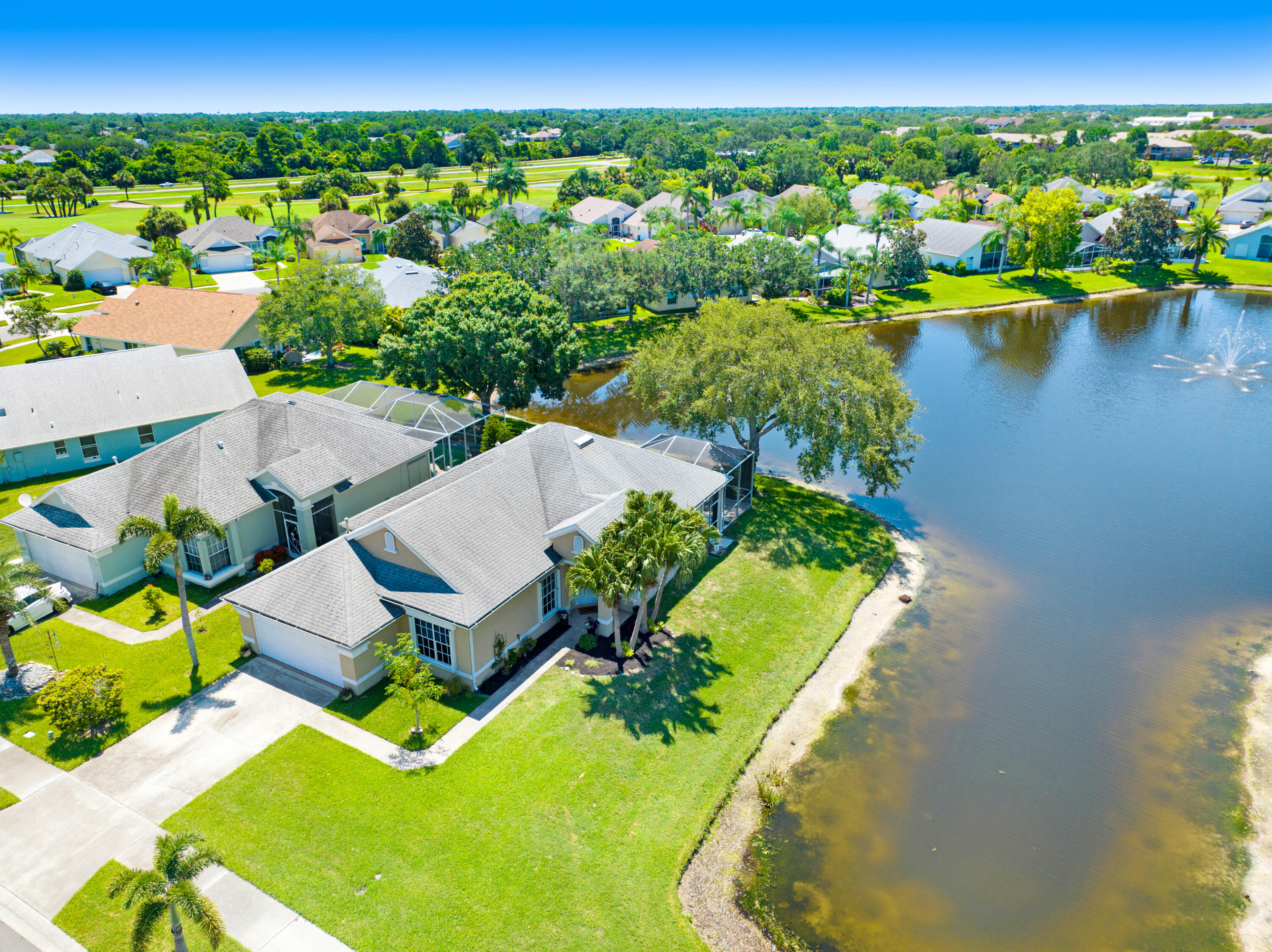 2299 Addington Circle Rockledge, FL 32955 - Photo 42 of 61 an aerial view of a house with a swimming pool yard and lake view