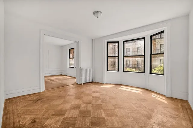 a picture of a bench in a white building