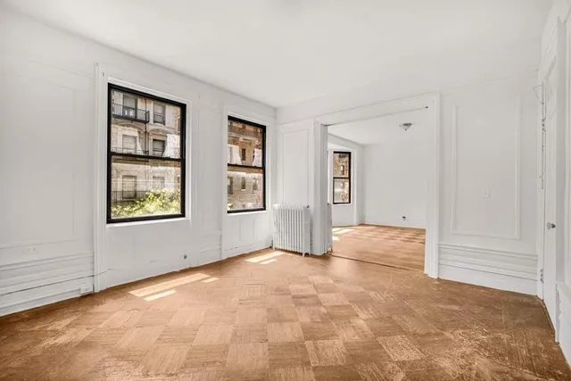 a view of a livingroom with furniture window and wooden floor