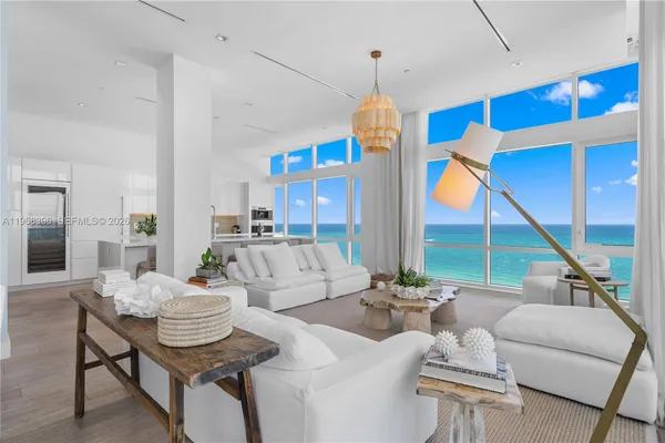 a view of living room with furniture and wooden floor