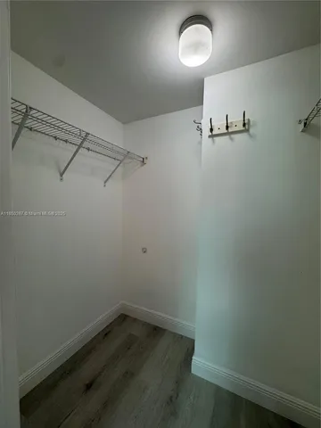 a room with pool table and a window