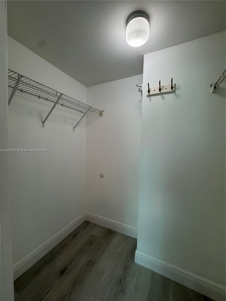 9201 Collins Avenue, Unit 323 Surfside, FL 33154 - Photo 21 of 46 a view of a room with racks on the wall