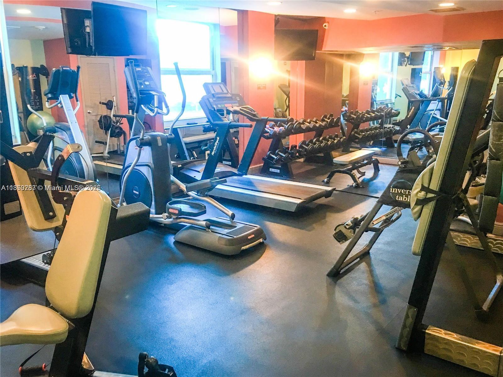 9201 Collins Avenue, Unit 323 Surfside, FL 33154 - Photo 23 of 46 a view of a room with gym equipment