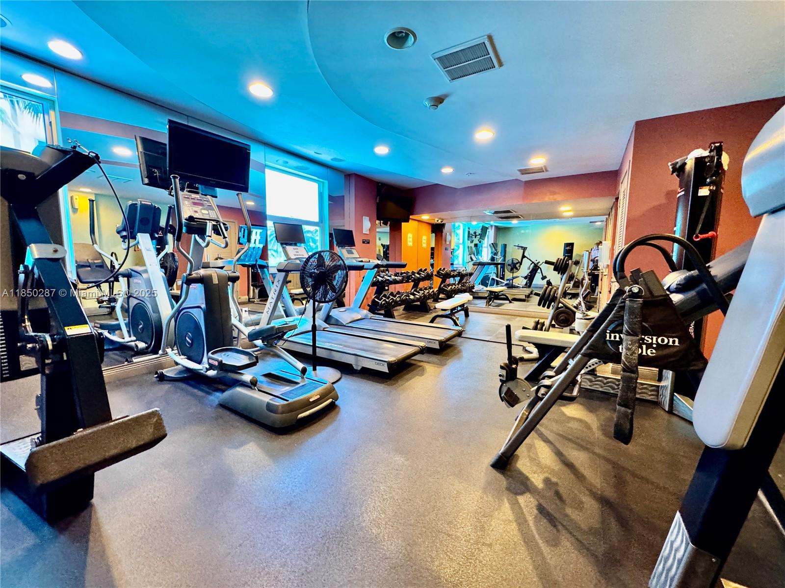 9201 Collins Avenue, Unit 323 Surfside, FL 33154 - Photo 32 of 46 a view of a room with gym equipment