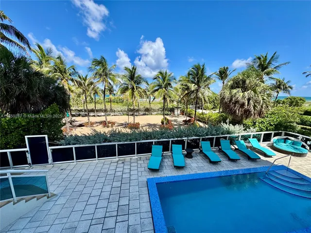 a kitchen with stainless steel appliances granite countertop a refrigerator a sink a stove with wooden cabinets