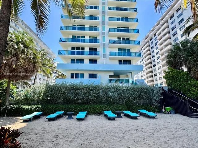 a view of swimming pool with chairs