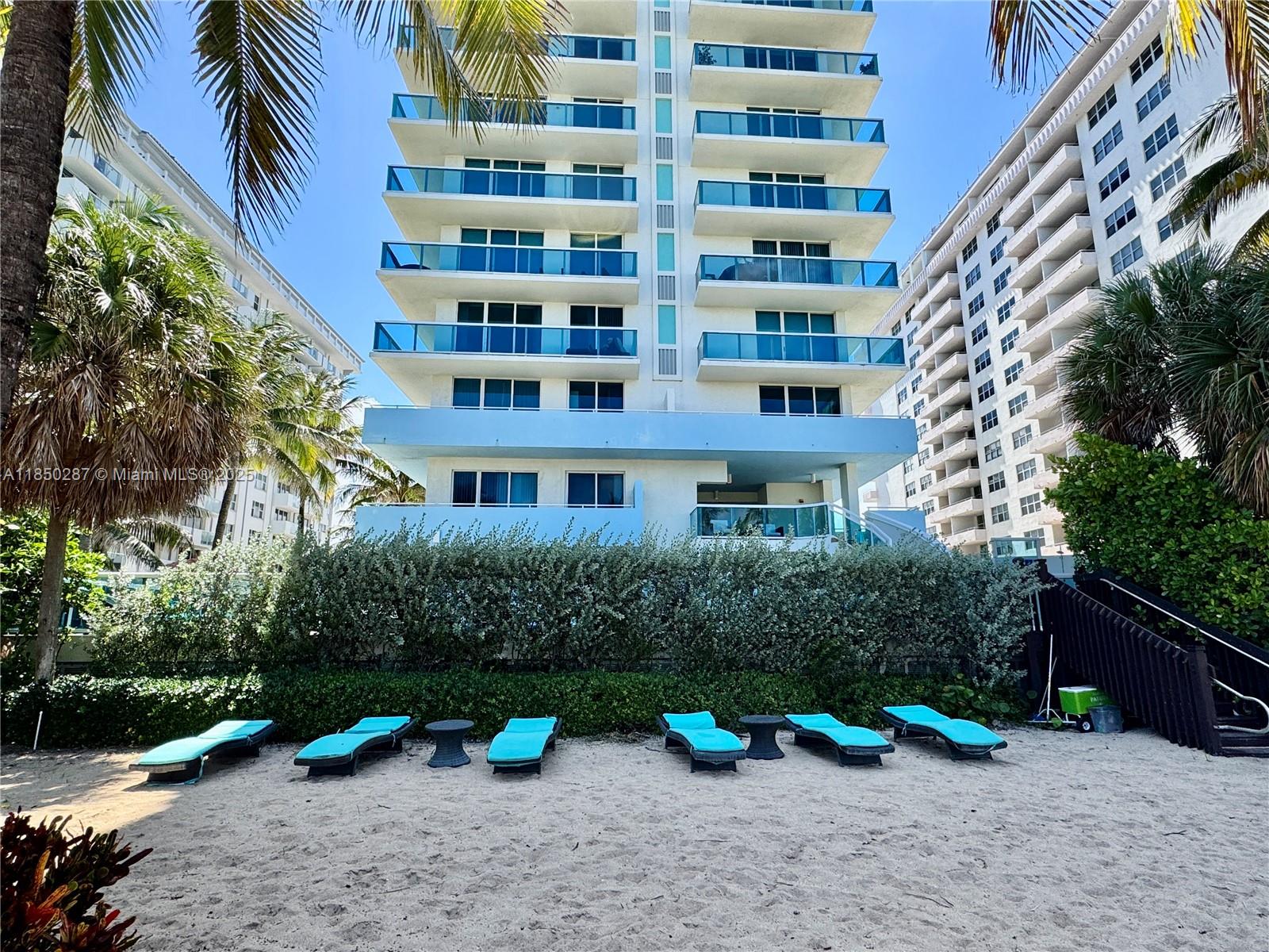 9201 Collins Avenue, Unit 323 Surfside, FL 33154 - Photo 41 of 46 a view of building with yard